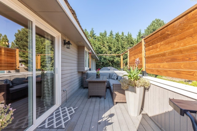 wooden deck with outdoor lounge area