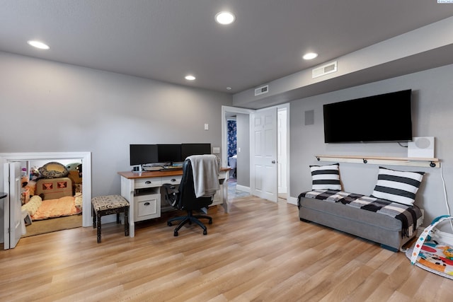 office space featuring recessed lighting, visible vents, and light wood-style floors