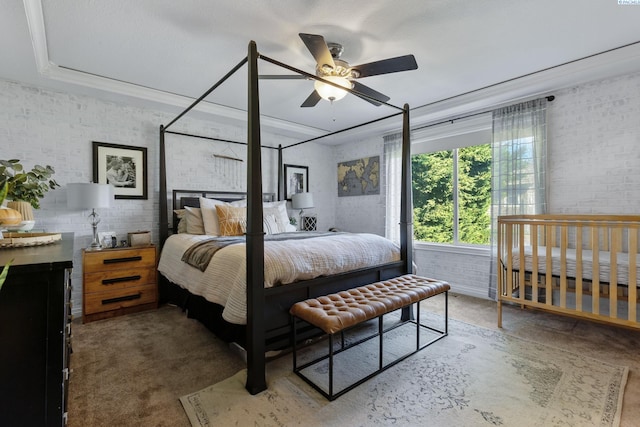 carpeted bedroom with brick wall and crown molding