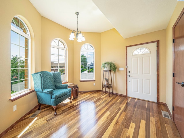 9203 Yakima Ct, Yakima, WA 98908 - foyer entrance featuring wood finished floors, a chandelier, and baseboards