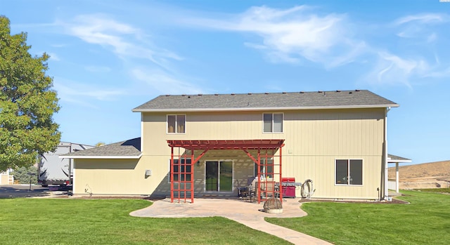 rear view of property featuring a patio, a lawn, and a pergola