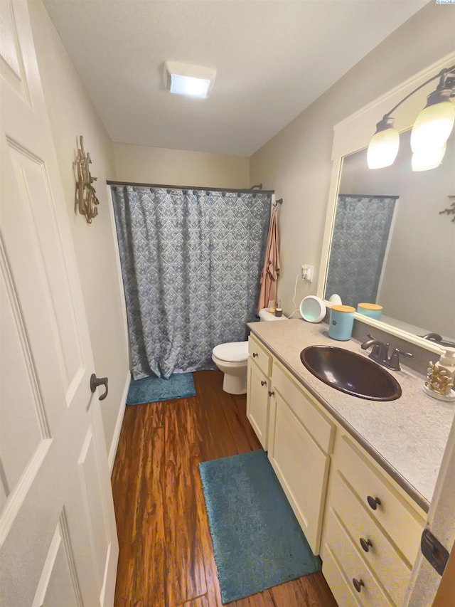 19624 Webber Canyon Rd, Benton City, WA 99320 - bathroom featuring curtained shower, toilet, wood finished floors, and vanity