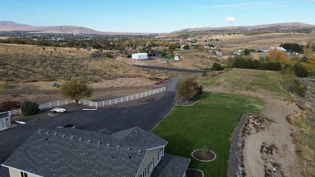 drone / aerial view featuring a rural view and a mountain view