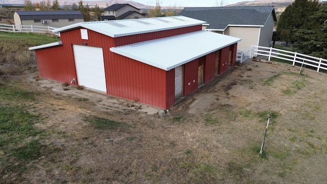 view of outdoor structure featuring an outdoor structure and fence