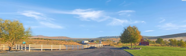 view of road featuring a rural view and a mountain view