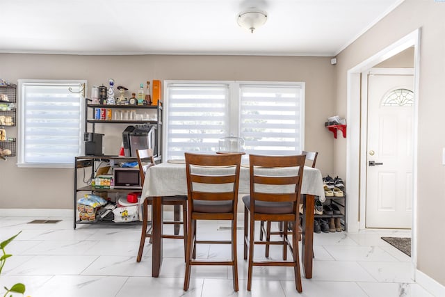 dining room with crown molding