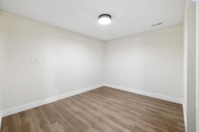 empty room featuring hardwood / wood-style floors