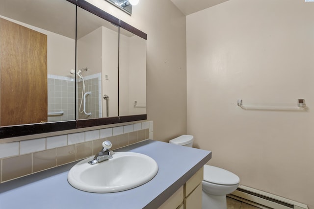 2001 Benson Ave, Prosser, WA 99350 - bathroom featuring baseboard heating, a tile shower, vanity, tasteful backsplash, and tile patterned floors