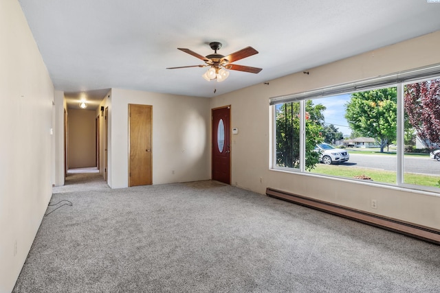 2001 Benson Ave, Prosser, WA 99350 - carpeted empty room with baseboard heating and a ceiling fan