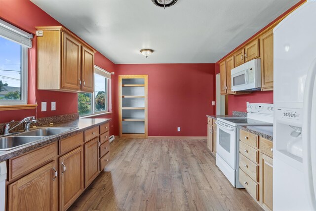 2001 Benson Ave, Prosser, WA 99350 - kitchen with white appliances, light wood-style floors, and dark countertops