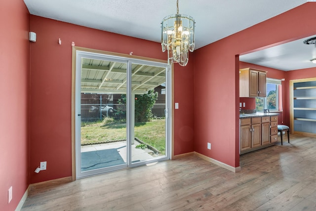 2001 Benson Ave, Prosser, WA 99350 - unfurnished dining area with a chandelier and light wood finished floors