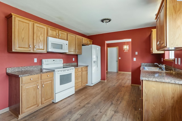 2001 Benson Ave, Prosser, WA 99350 - kitchen with white appliances and wood finished floors