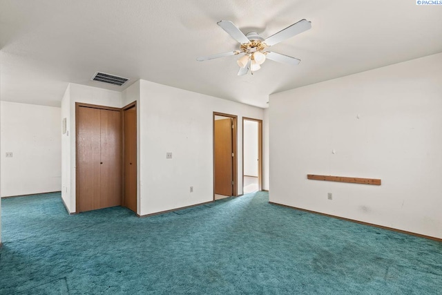 unfurnished bedroom with carpet, ceiling fan, and a closet