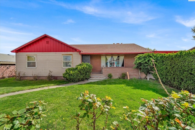 ranch-style house with a front yard