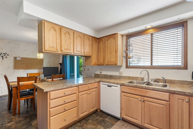 5500 W 26th Ave, Kennewick, WA 99338 - kitchen featuring white dishwasher, a sink, plenty of natural light, a peninsula, and wallpapered walls