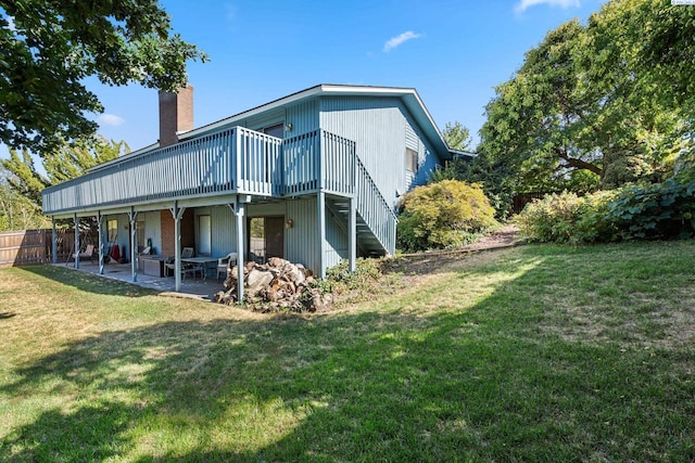 5500 W 26th Ave, Kennewick, WA 99338 - rear view of house featuring a chimney, a deck, and a patio