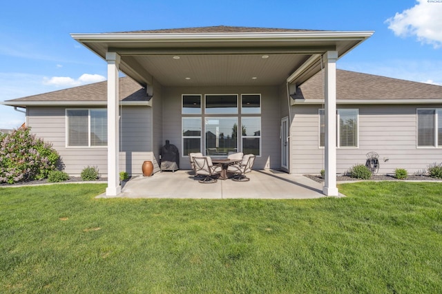 6624 Recurve Rd, Pasco, WA 99301 - rear view of house with a patio, a lawn, and a shingled roof
