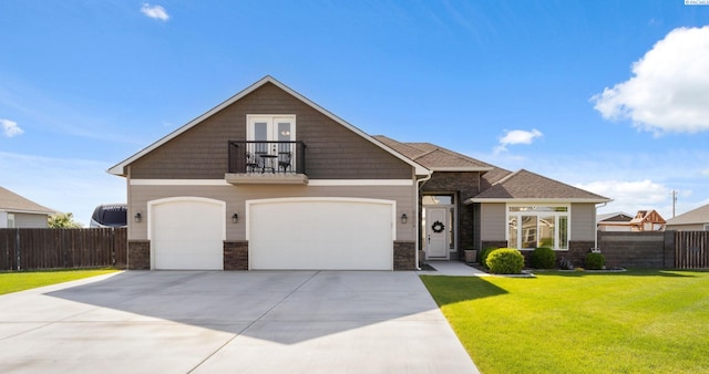6624 Recurve Rd, Pasco, WA 99301 - view of front facade featuring a balcony, stone siding, driveway, and a garage