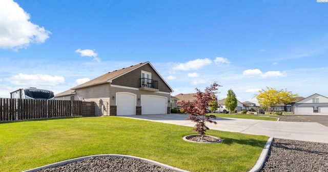 6624 Recurve Rd, Pasco, WA 99301 - view of home's exterior with driveway, an attached garage, and stone siding
