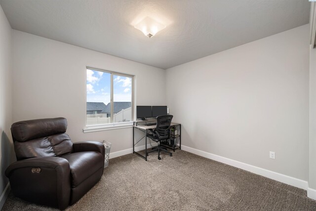 office area featuring carpet and baseboards