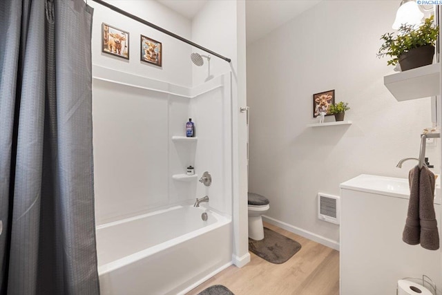 736 E 5th Ave, Kennewick, WA 99336 - bathroom with wood finished floors, shower / bath combo with shower curtain, and vanity