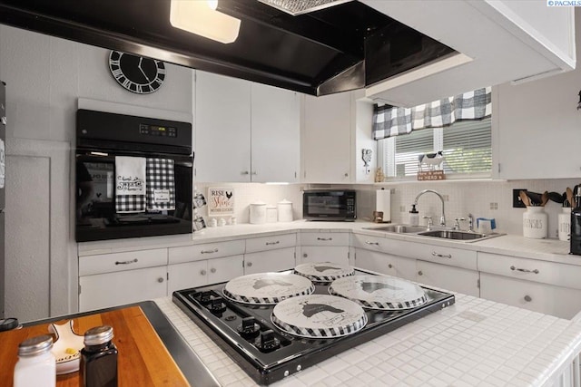 736 E 5th Ave, Kennewick, WA 99336 - kitchen with black appliances, white cabinets, light countertops, and tasteful backsplash
