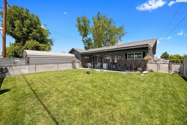 736 E 5th Ave, Kennewick, WA 99336 - rear view of property with a fenced backyard, a patio, and a gate