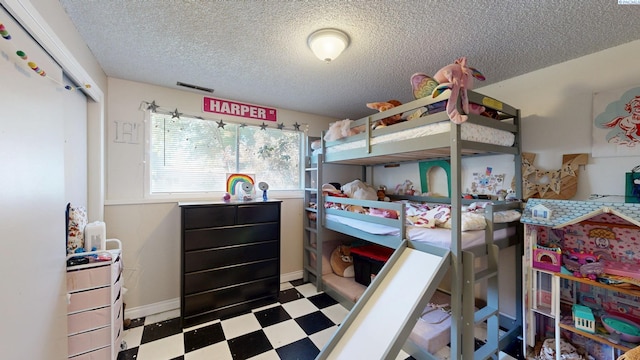 220 E Cannon, Palouse, WA 99161 - bedroom with tile patterned floors and a textured ceiling