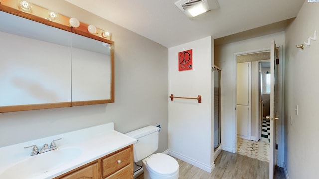 220 E Cannon, Palouse, WA 99161 - full bathroom featuring vanity, a shower stall, and wood finished floors