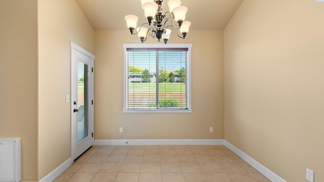 1867 S Fescue St, Kennewick, WA 99338 - unfurnished dining area featuring a chandelier and light tile patterned floors
