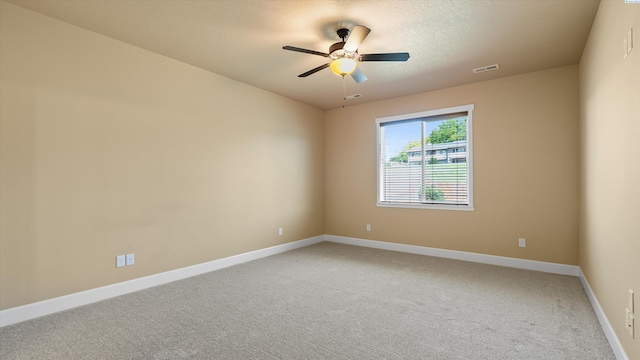 1867 S Fescue St, Kennewick, WA 99338 - empty room featuring light colored carpet and ceiling fan