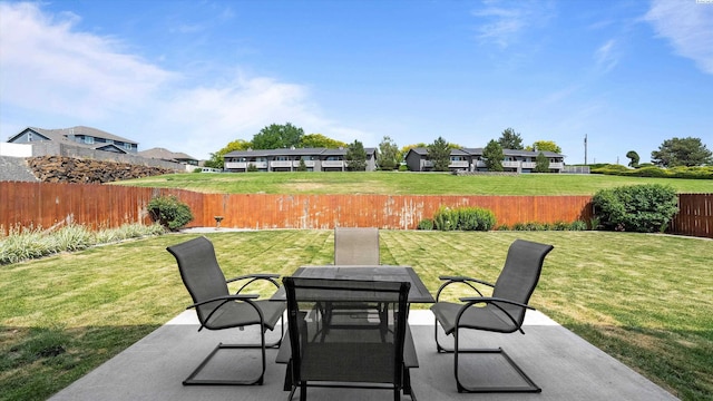 1867 S Fescue St, Kennewick, WA 99338 - fenced backyard featuring a patio area, outdoor dining area, and a residential view
