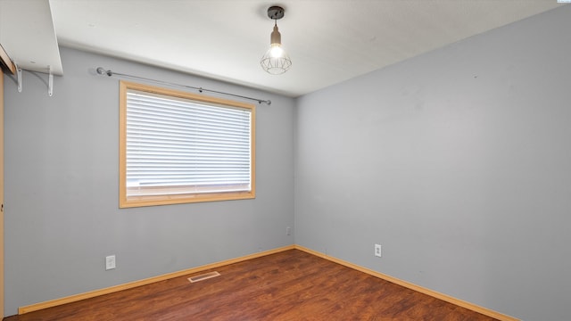 5704 Taft Dr, Pasco, WA 99301 - unfurnished room featuring wood finished floors and baseboards