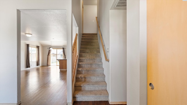 5704 Taft Dr, Pasco, WA 99301 - stairs featuring wood finished floors and baseboards