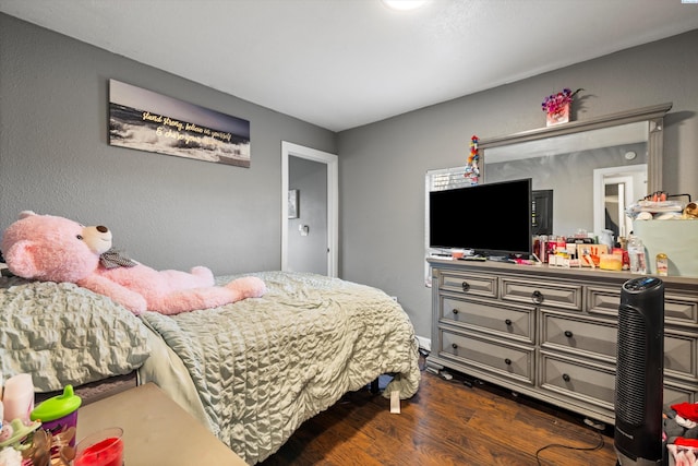 bedroom featuring dark wood-style floors