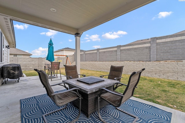 view of patio / terrace featuring outdoor dining space, a fenced backyard, and grilling area