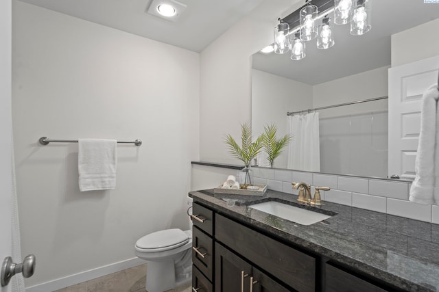 bathroom featuring tile patterned floors, toilet, decorative backsplash, baseboards, and vanity