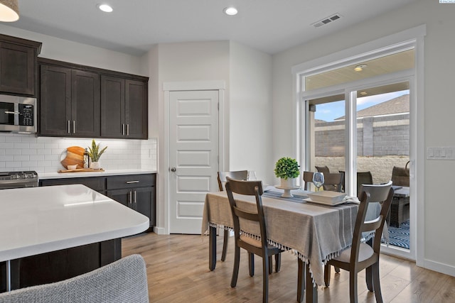 dining area with recessed lighting, visible vents, baseboards, and light wood-style flooring