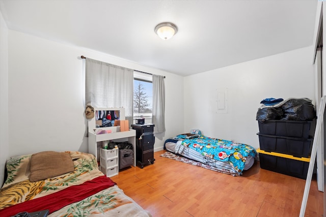 bedroom with wood finished floors