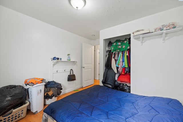 bedroom featuring a closet and wood finished floors