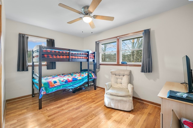 bedroom featuring light hardwood / wood-style flooring and ceiling fan