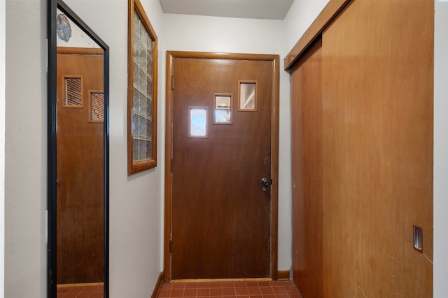 entryway with light tile patterned floors