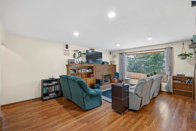 living room featuring hardwood / wood-style floors and a fireplace