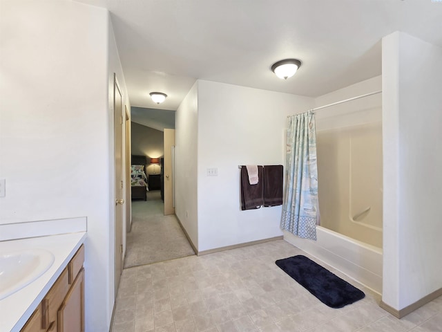 2650 Dornoch Pl, Richland, WA 99354 - full bathroom featuring vanity, shower / tub combo with curtain, ensuite bath, and baseboards