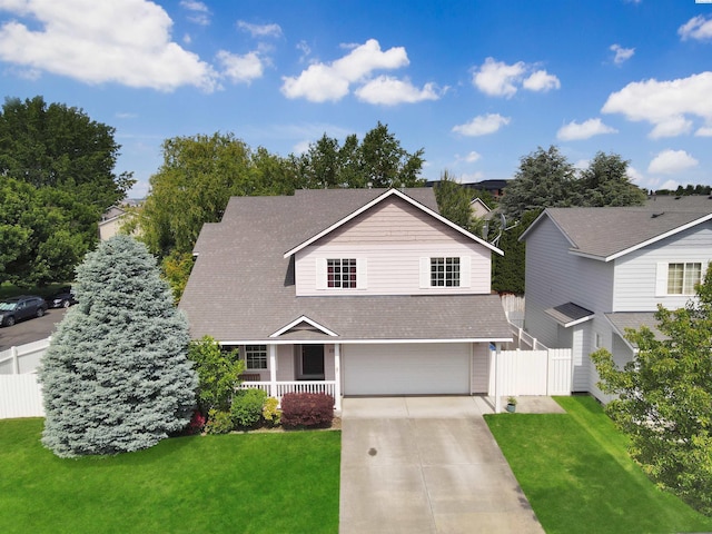 2650 Dornoch Pl, Richland, WA 99354 - view of front of property featuring covered porch, a garage, concrete driveway, and roof with shingles