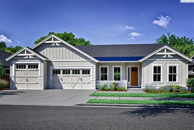 view of front of house with a garage and a porch