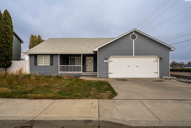 single story home with a garage and covered porch