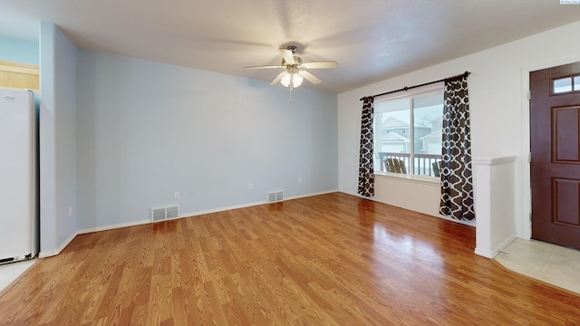 interior space with light hardwood / wood-style floors and ceiling fan