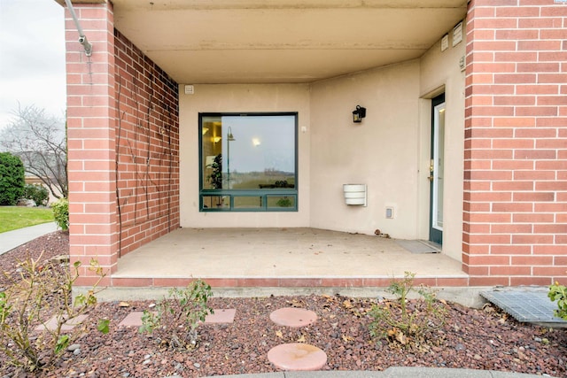 doorway to property with a patio