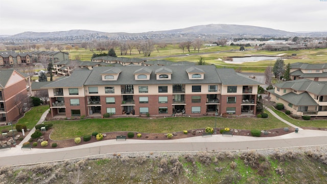 drone / aerial view featuring a mountain view